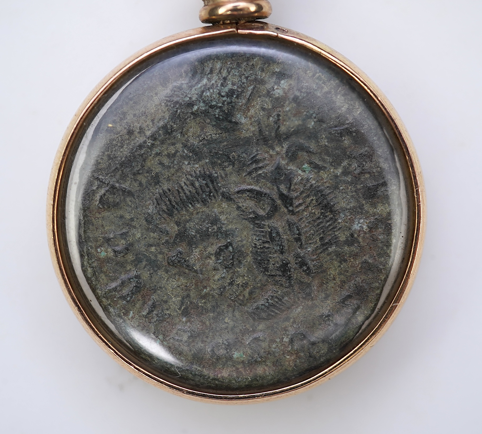 A gold and Roman bronze coin pendant